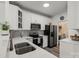 Modern kitchen with stainless steel appliances, white cabinetry, and stylish countertops at 11839 Ridgeway Park Dr, Charlotte, NC 28277