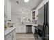 Sleek kitchen with stainless steel appliances, ample counter space, and bright white cabinets at 11839 Ridgeway Park Dr, Charlotte, NC 28277
