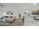 Bright living area showcasing a comfortable sectional sofa, modern decor, and wood floors at 11839 Ridgeway Park Dr, Charlotte, NC 28277