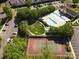See the community pool and tennis court, along with parking, and landscaping at 11839 Ridgeway Park Dr, Charlotte, NC 28277