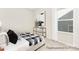 Cozy bedroom featuring a large window with natural light and modern decor at 1303 Links Crossing Dr # 219, Monroe, NC 28112