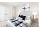 Bedroom with neutral walls, carpet floors, and ample lighting with a view of the closet at 1303 Links Crossing Dr # 219, Monroe, NC 28112