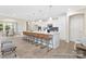 Open-concept kitchen with a large island, perfect for entertaining, adjacent to the dining area at 1303 Links Crossing Dr # 219, Monroe, NC 28112