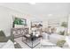 Comfortable living room with view into bright dining area and modern kitchen at 1303 Links Crossing Dr # 219, Monroe, NC 28112