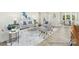 Modern living room with open floor plan, connecting kitchen and dining, creating an inviting atmosphere at 1303 Links Crossing Dr # 219, Monroe, NC 28112