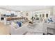 Open-concept living space featuring a modern kitchen island and comfortable seating area at 1303 Links Crossing Dr # 219, Monroe, NC 28112