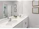 Bright bathroom featuring a double sink vanity, quartz countertops, and a large mirror at 134 Falling Up Ln, Salisbury, NC 28147