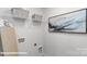 Practical laundry area includes storage, shelving, and artistic decor in a convenient layout at 134 Falling Up Ln, Salisbury, NC 28147