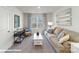 Comfortable living room with a neutral sofa, stylish decor, and a view to the backyard at 134 Falling Up Ln, Salisbury, NC 28147