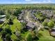 An aerial view showcasing the house, lush backyard, mature trees, and the layout of the neighborhood at 135 Northbridge Dr, Mooresville, NC 28115