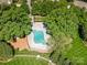 Aerial shot of the community pool with surrounding lounge area and mature trees at 135 Northbridge Dr, Mooresville, NC 28115