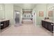 Expansive bathroom with double vanities, tile floors, and a large soaking tub at 135 Northbridge Dr, Mooresville, NC 28115
