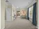 Bright bedroom with neutral walls, carpet, and natural light streaming through large windows at 135 Northbridge Dr, Mooresville, NC 28115