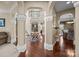 Spacious foyer with arched doorways, hardwood floors, staircase, and elegant decor at 135 Northbridge Dr, Mooresville, NC 28115