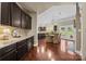 Gourmet kitchen featuring granite countertops, stainless appliances, and rich wood cabinetry; great storage and space at 135 Northbridge Dr, Mooresville, NC 28115