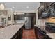 Updated kitchen features modern appliances, stylish granite counters, and ample cabinet space; ready to move in at 135 Northbridge Dr, Mooresville, NC 28115