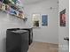 Laundry room features modern washer and dryer and plenty of shelving; makes chores easy at 135 Northbridge Dr, Mooresville, NC 28115