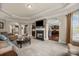 Spacious living room with fireplace and open floor plan to kitchen; perfect for entertaining Gathering and friends at 135 Northbridge Dr, Mooresville, NC 28115