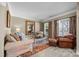 Cozy living room with comfortable seating, large windows, and neutral decor at 135 Northbridge Dr, Mooresville, NC 28115