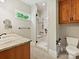 Bathroom with a glass-enclosed shower, granite countertop, and wooden cabinets, blending style and functionality at 1413 Willow Oaks Trl, Weddington, NC 28104