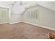 Bedroom featuring carpet, plantation shutters, dormer ceilings and a ceiling fan at 1413 Willow Oaks Trl, Weddington, NC 28104