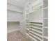 Well-organized walk-in closet with built-in shelving and drawers for optimal storage and convenience at 1413 Willow Oaks Trl, Weddington, NC 28104