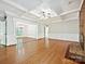 Spacious living room with fireplace, hardwood floors, and open layout at 1413 Willow Oaks Trl, Weddington, NC 28104