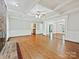 Spacious living room boasting wood floors, a fireplace, coffered ceilings and natural light at 1413 Willow Oaks Trl, Weddington, NC 28104