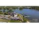 Stunning aerial view of waterfront condominiums, a restaurant with outdoor seating, and a marina with boats at 143 S Gibbs Rd, Mooresville, NC 28117