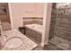 Bathroom showcasing a soaking tub, tiled shower with a glass door, and a granite countertop sink at 143 S Gibbs Rd, Mooresville, NC 28117