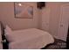 Cozy bedroom with natural light, light colored walls, and decorative ocean-themed wall art at 143 S Gibbs Rd, Mooresville, NC 28117