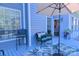 Cozy deck view with comfortable chairs, umbrella, and an entry view at 143 S Gibbs Rd, Mooresville, NC 28117