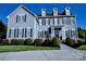 A beautiful gray two-story home with black shutters and well-manicured landscaping at 143 S Gibbs Rd, Mooresville, NC 28117