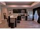 Modern kitchen with dark cabinets, stainless steel appliances and granite countertops, with a kitchen bar area at 143 S Gibbs Rd, Mooresville, NC 28117
