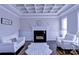 Bright living room featuring a fireplace, sofas, and a decorative ceiling at 143 S Gibbs Rd, Mooresville, NC 28117