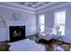 Bright living room featuring a fireplace, white sofa, and a decorative ceiling at 143 S Gibbs Rd, Mooresville, NC 28117