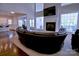 Spacious living room features a fireplace, large windows and open floor plan into kitchen and dining area at 143 S Gibbs Rd, Mooresville, NC 28117