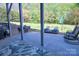 Inviting patio with outdoor seating, green foliage, and a grill at 143 S Gibbs Rd, Mooresville, NC 28117