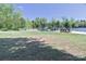 Beautiful waterfront view with a boat dock, seating, and green lawns at 143 S Gibbs Rd, Mooresville, NC 28117