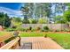 Spacious backyard featuring a wooden deck, a bench, and a well-maintained lawn at 1473 12Th Street Nw Dr, Hickory, NC 28601