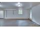 Unfinished basement with painted brick walls, window, and an entrance door at 1473 12Th Street Nw Dr, Hickory, NC 28601