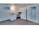 Basement kitchenette with a fridge, sink, microwave, and exterior door at 1473 12Th Street Nw Dr, Hickory, NC 28601