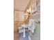 Charming bathroom with pedestal sink, tiled walls, patterned wallpaper, and window with shutters at 1473 12Th Street Nw Dr, Hickory, NC 28601
