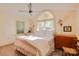 Bright bedroom features a large window, ceiling fan, and neutral décor creating a calming atmosphere at 1473 12Th Street Nw Dr, Hickory, NC 28601