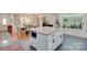 Open concept kitchen with center island and dining area with hardwood floors at 1473 12Th Street Nw Dr, Hickory, NC 28601