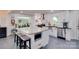 Open concept kitchen featuring granite countertops, an island with bar stools, and modern appliances at 1473 12Th Street Nw Dr, Hickory, NC 28601