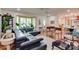 Bright living room with a plush sofa, decorative rug, and natural light streaming through the large bay window at 1473 12Th Street Nw Dr, Hickory, NC 28601