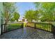 View from back deck overlooking yard with mature shade trees at 16718 Hampton Crossing Dr, Huntersville, NC 28078