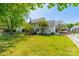 Spacious backyard with mature trees, a white picket fence, and a deck, ideal for outdoor entertaining and Gathering activities at 16718 Hampton Crossing Dr, Huntersville, NC 28078