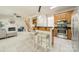 Kitchen featuring a breakfast bar that connects it with the living room and fireplace at 16718 Hampton Crossing Dr, Huntersville, NC 28078